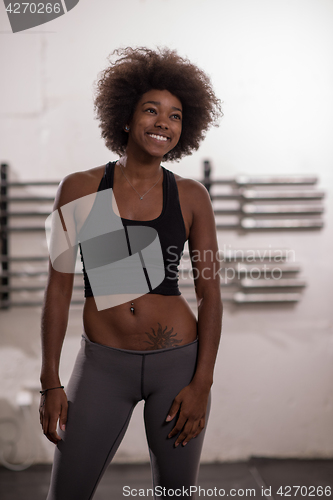 Image of black woman after a workout at the gym