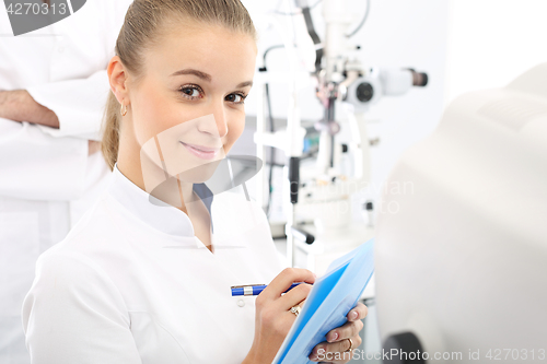 Image of Ophthalmology, eye doctors office.  Young attractive doctor ophthalmologist at an ophthalmologist 