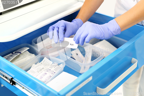 Image of A nurse prepares an injection