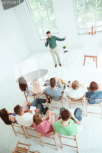 Image of Speaker at Business Meeting in the conference hall.