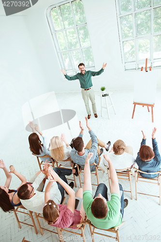 Image of Speaker at Business Meeting in the conference hall.