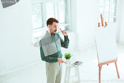 Image of Speaker at Business Meeting in the conference hall.