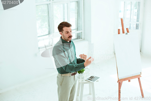 Image of Speaker at Business Meeting in the conference hall.