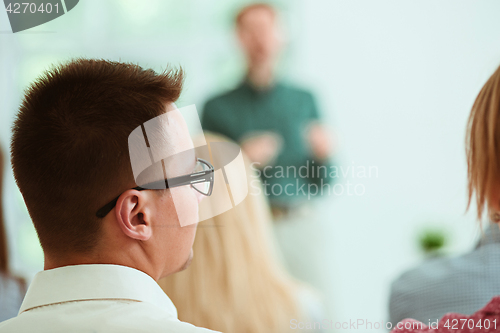 Image of Speaker at Business Meeting in the conference hall.