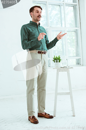 Image of Speaker at Business Meeting in the conference hall.