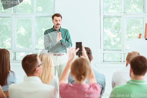 Image of Speaker at Business Meeting in the conference hall.