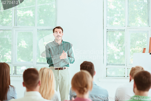 Image of Speaker at Business Meeting in the conference hall.