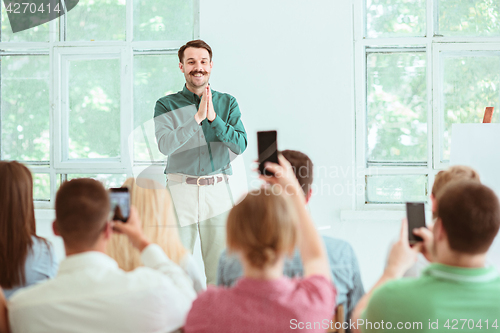 Image of Speaker at Business Meeting in the conference hall.