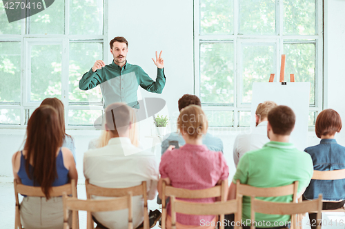 Image of Speaker at Business Meeting in the conference hall.