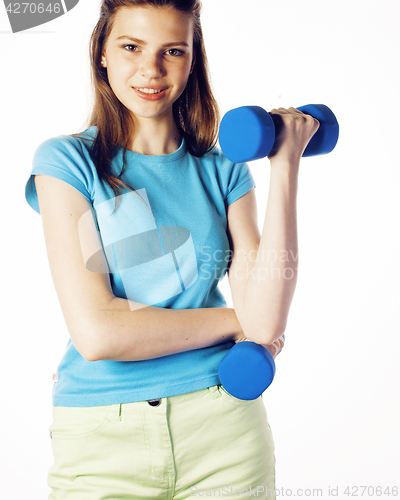 Image of young pretty slim blond woman with dumbbell isolated cheerful smiling, measuring herself, diet people concept on white background