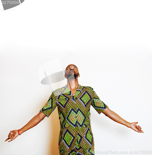 Image of portrait of young handsome african man wearing bright green nati