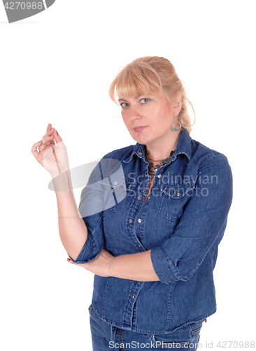 Image of Blond woman thinking.