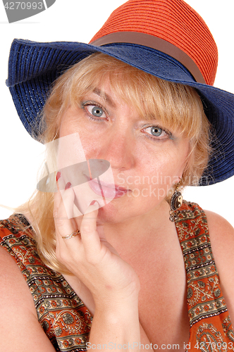 Image of Closeup heath shoot of woman with hat.