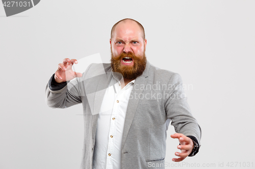 Image of Screaming, furious man with beard