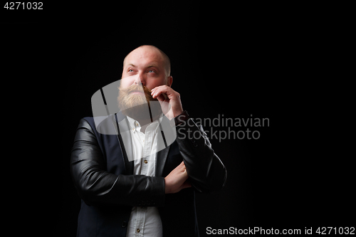 Image of Pensive man twirling his mustache