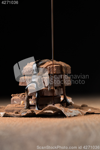 Image of Broken chocolate sprinkled with syrup