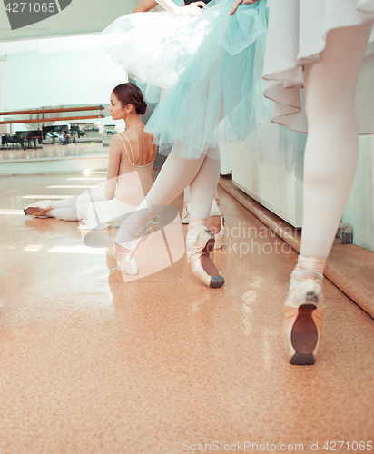 Image of The seven ballerinas at ballet bar