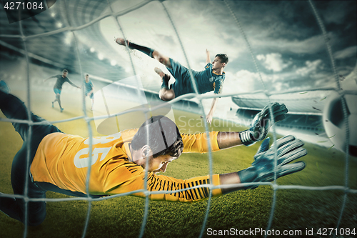 Image of Goalkeeper in gates jumping to catching ball