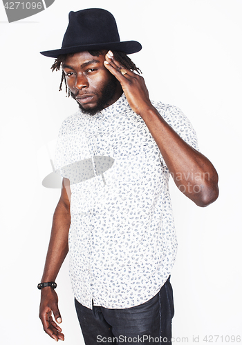 Image of young handsome afro american boy in stylish hipster hat gesturin