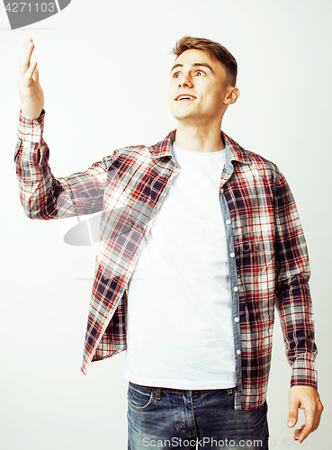 Image of young handsome teenage hipster guy posing emotional, happy smiling against white background isolated, lifestyle people concept