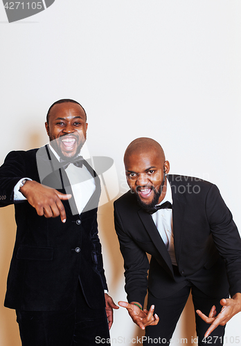 Image of two afro-american businessmen in black suits emotional posing, g