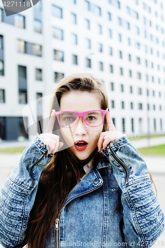Image of young pretty hipster girl student with coffee cup posing adorable smiling, lifestyle people concept outdoor