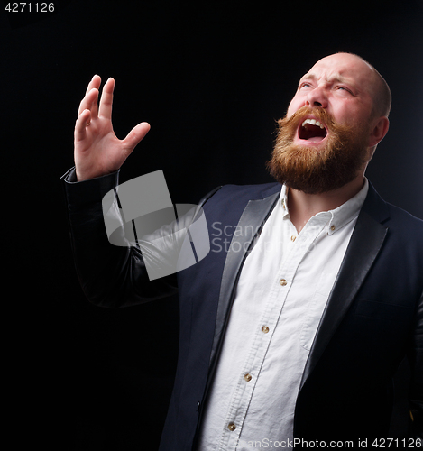Image of Man with ginger mustache sings