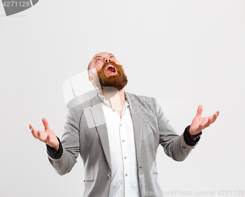 Image of Disgruntled screaming man looking up