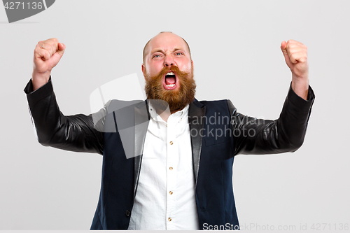 Image of Brutal man with hands up