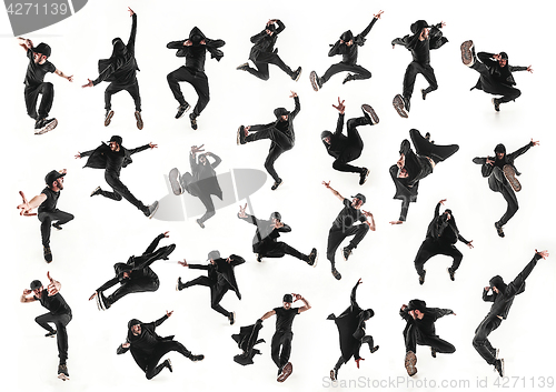 Image of The silhouette of one hip hop male break dancer dancing on white background