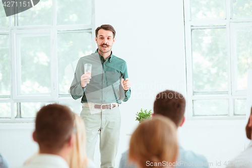 Image of Speaker at Business Meeting in the conference hall.