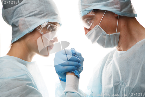 Image of Young medical workers make handshake