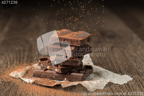 Image of Pieces of chocolate sprinkled cocoa