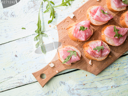 Image of Sandwiches ,ham on wooden table