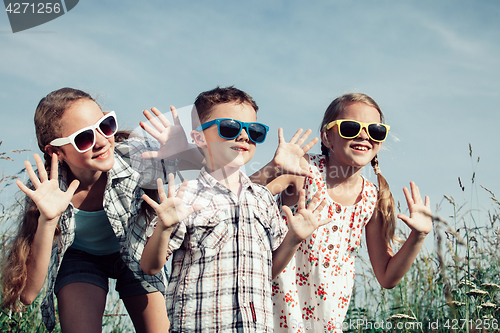 Image of Happy children playing on the field at the day time.