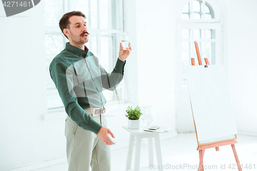 Image of Speaker at Business Meeting in the conference hall.