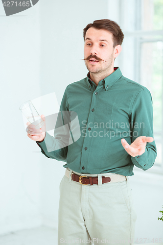 Image of Speaker at Business Meeting in the conference hall.