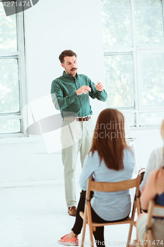 Image of Speaker at Business Meeting in the conference hall.