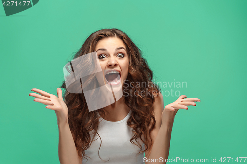 Image of Portrait of young woman with shocked facial expression