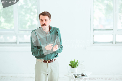 Image of Speaker at Business Meeting in the conference hall.