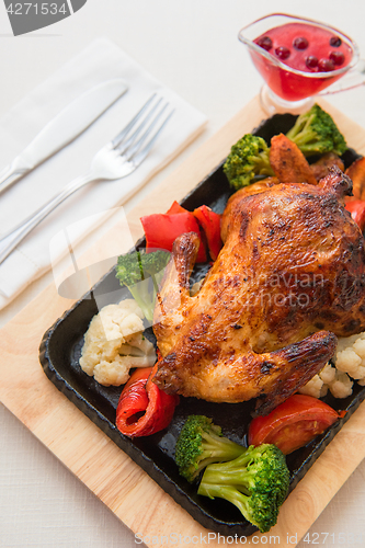 Image of Roasted chicken with vegetables.