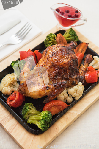 Image of Roasted chicken with vegetables.