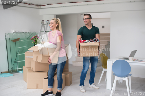 Image of young couple moving into a new home