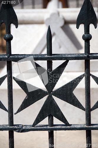 Image of maltese cross wrought iron fence