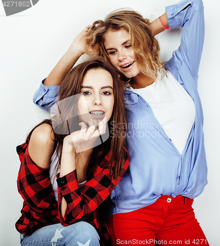 Image of best friends teenage girls together having fun, posing emotional on white background, besties happy smiling, lifestyle people concept close up. making selfie