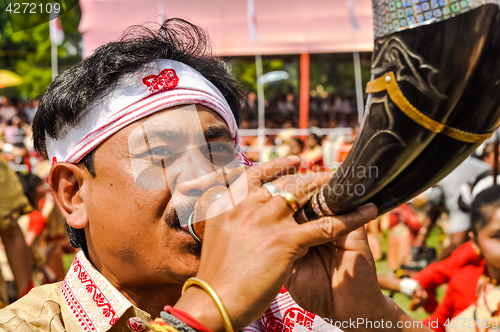 Image of Blowing of horn in Assam
