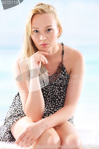 Image of Holiday relaxation, woman resting on the beach. 