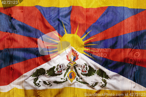 Image of National flag of Tibet, wooden background