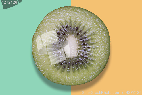 Image of Piece of kiwi on colorful background