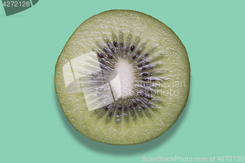 Image of Piece of kiwi on colorful background